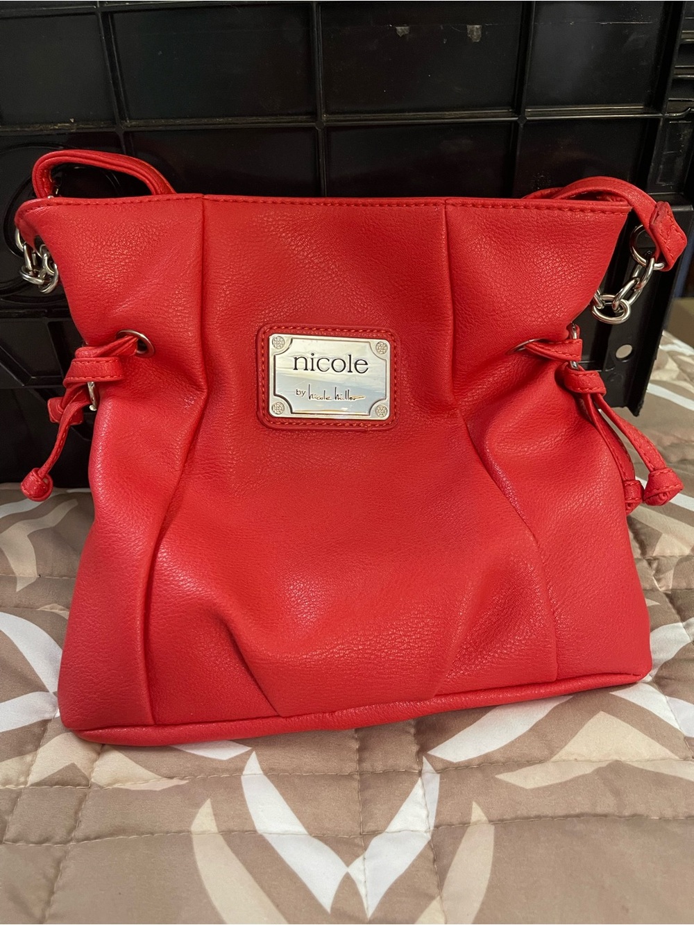 Nicole by Nicole Miller Red Drawstring Shoulder Bag with Logo Plaque